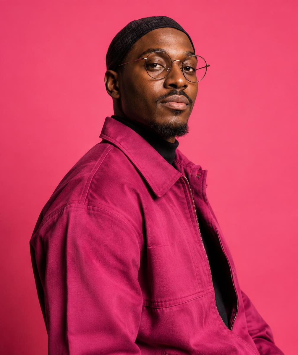 Muslim creator against a vivid pink backdrop